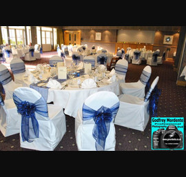 Navy single bow on white chair cover at Rufflets Hotel