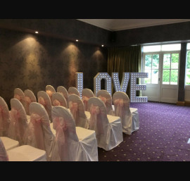 Pale pink organza with lace on white chair covers
