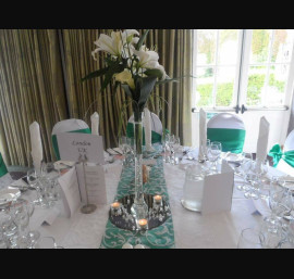 Emerald green satin on white chair covers