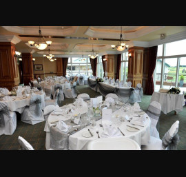 Silver organza bows on white chair covers
