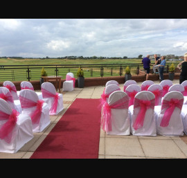 Cerise pink organza on white chair covers