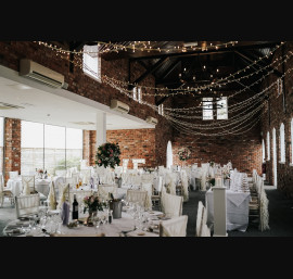 Ivory Ruffle Tail Hoods on Limewash Chiavari Chairs
