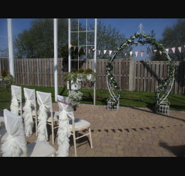 Ivory Ruffle Tail Hoods on Limewash Chiavari Chairs