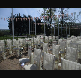 Ivory Ruffle Tail Hoods on Limewash Chiavari Chairs