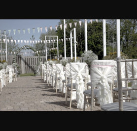 Ivory Ruffle Tail Hoods on Limewash Chiavari Chairs