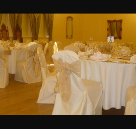 Champagne flock sashes on butter chair covers at Doxford Hall