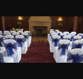 White Chair Covers and Midnight Blue bows at Doxford Hall
