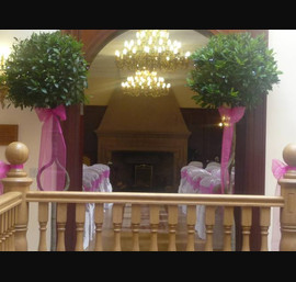 White Chair Covers and Fushia Pink bows at Doxford Hall