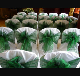 White Chair Covers and Hunter green bows at Doxford Hall