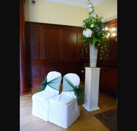 White Chair Covers and Hunter green bows at Doxford Hall
