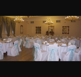 Tiffany blue organza sashes with white chair covers at Doxford Hall