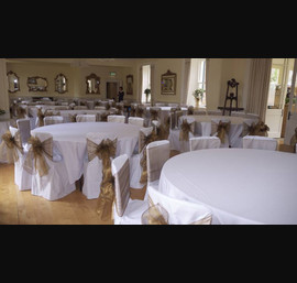 White Chair Covers and Bronze Bows at Eshott Hall