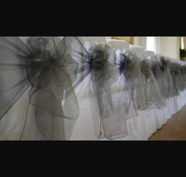 White Chair Covers and Silver Bows at Eshott Hall