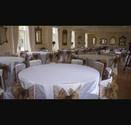 White Chair Covers and Bronze Bows at Eshott Hall