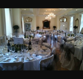 White Chair Covers and Silver Bows at Eshott Hall