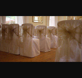 White Chair Covers and Champagne bows at Eshott Hall