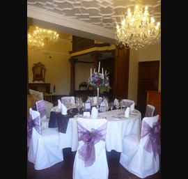 White Chair Covers and Heather bows at Guyzance Hall