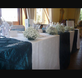 White Chair Covers and Teal Bows at Guyzance Hall