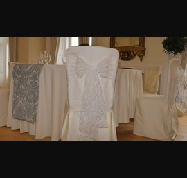 Cream lace bow on a buttermilk chair cover