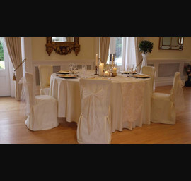 Buttermilk chair covers and table cloths with cream flock runner