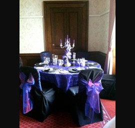 Black Chair Covers and Cadbury Purple Bows at Longhirst Hall