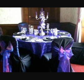 Black Chair Covers and Cadbury Purple Bows at Longhirst Hall