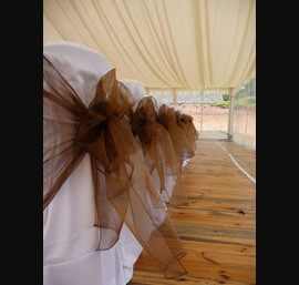 White Chair Covers and Chocolate Brown bows at Otterburn Hall