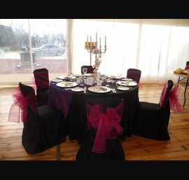 Black Chair Covers and Cadbury Purple Bows at Otterburn Hall
