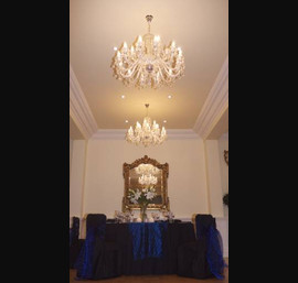 Midnight blue pin tuck taffeta table runners with matching bows on black linen