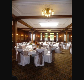 White Chair Covers and Chocolate Brown Bows at The White Swan