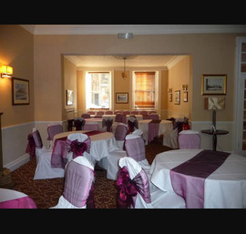 White Chair Covers and Wine bows at The White Swan
