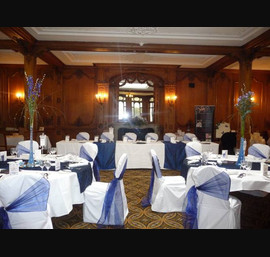 White Chair Covers and Midnight blue side bows with midnight taffeta runners at The White Swan