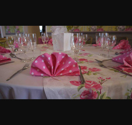 Floral runner with pink polka dot napkin at Woodhill Hall