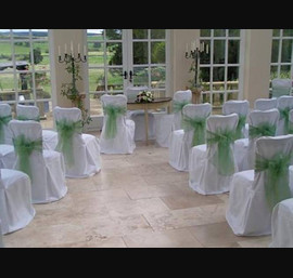 White Chair Covers with willow sashes at Woodhill Hall