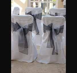 White Chair Covers and Black and White Bows at Woodhill Hall